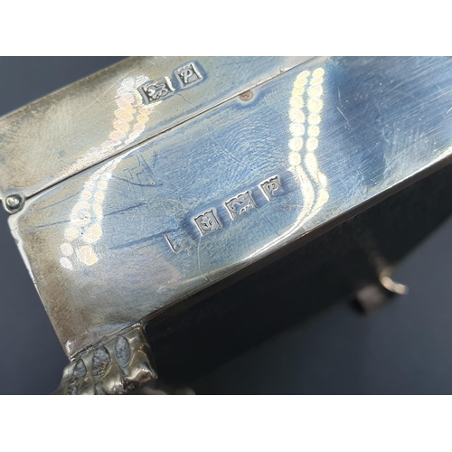 79 - An Elizabeth II silver Cigarette Box with engine turning and engraved inscription on paw feet, Birmi... 