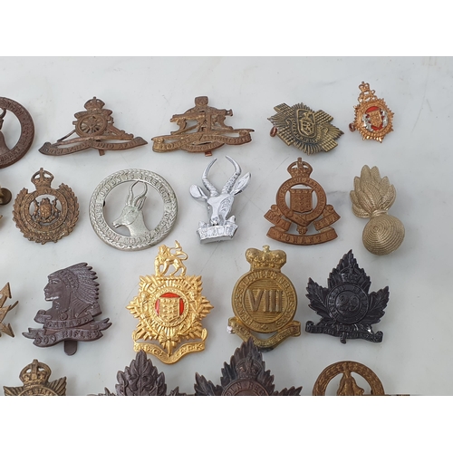 794 - A collection of British Corps Badges