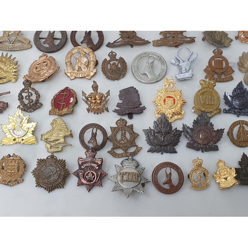 794 - A collection of British Corps Badges