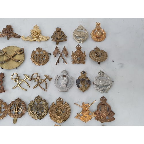 794 - A collection of British Corps Badges