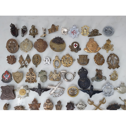 795 - A quantity of British Corps Badges