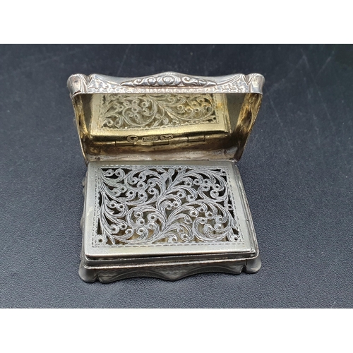 80 - A Victorian silver rectangular Vinaigrette with engine turning and vacant cartouche, scroll pierced ... 