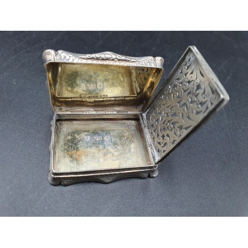 80 - A Victorian silver rectangular Vinaigrette with engine turning and vacant cartouche, scroll pierced ... 