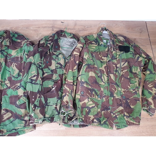 819 - Four British Army camouflage Combat Jackets