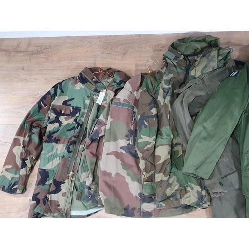 821 - Four Non-British Army camouflage Combat Jackets and a Parka style Jacket