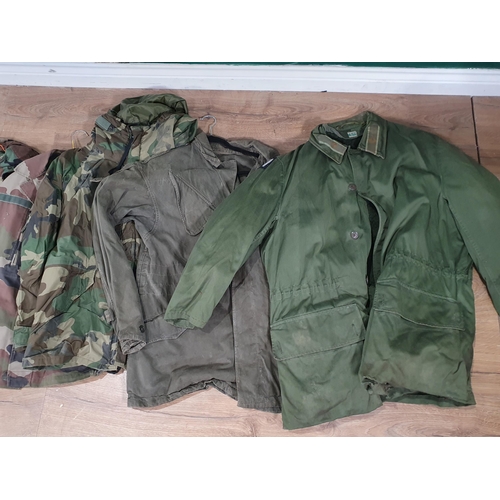 821 - Four Non-British Army camouflage Combat Jackets and a Parka style Jacket