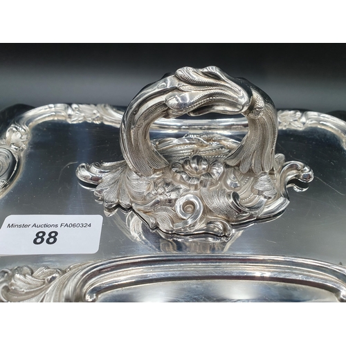 88 - A pair of early Victorian silver oblong Entree Dishes and Covers with scroll rims, ornate leafage ce... 