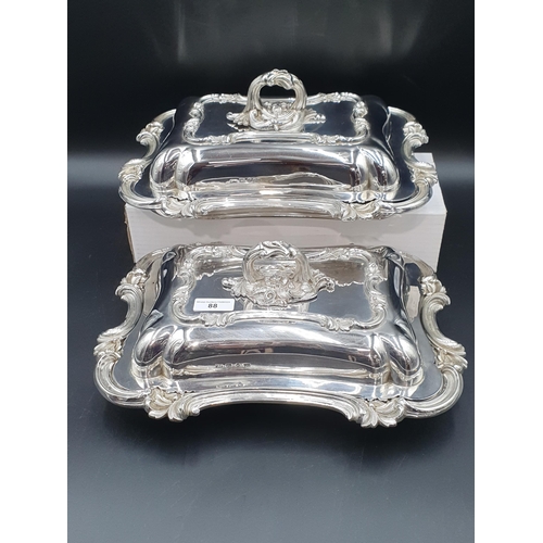 88 - A pair of early Victorian silver oblong Entree Dishes and Covers with scroll rims, ornate leafage ce... 