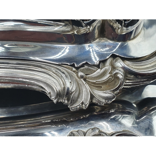 88 - A pair of early Victorian silver oblong Entree Dishes and Covers with scroll rims, ornate leafage ce... 