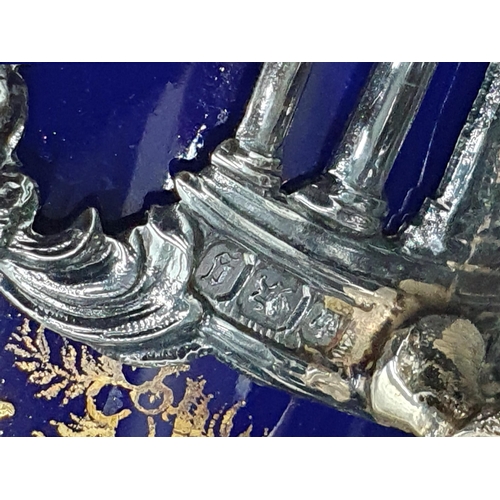 109 - Four Victorian silver Cup Holders pierced and embossed cherubs, engraved initial W within shaped car... 