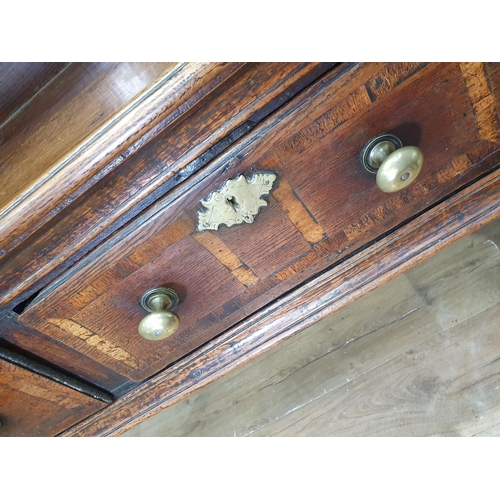 528 - An 18th Century oak Dresser Base with raised back, fitted four crossbanded frieze drawers on turned ... 