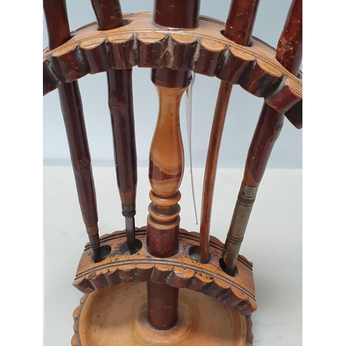 563 - A set of antique treen Tools with bulldog head handles within turned wooden Stand 8 1/2in H