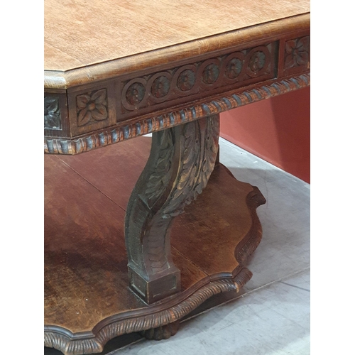 631 - A Victorian Continental oak octagonal Centre Table with moulded edge, with carved frieze, raised on ... 