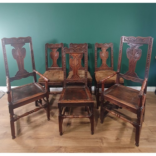 623 - A set of six 19th Century carved oak Dining Chairs with floral carved splat backs, solid seats and s... 