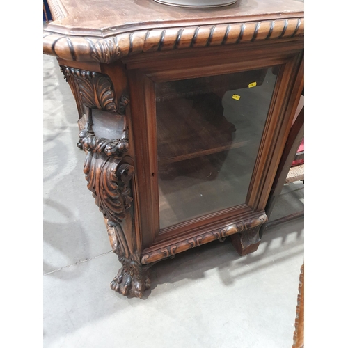 538 - A carved walnut Display Cabinet with bevelled glazed front panel flanked by acanthus leaf pillars wi... 