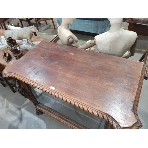 538 - A carved walnut Display Cabinet with bevelled glazed front panel flanked by acanthus leaf pillars wi... 