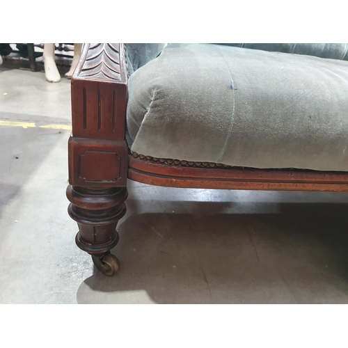 576 - A 19th Century carved walnut Salon Chesterfield, the button down back and stuff over seat on taper t... 