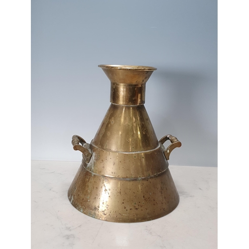 418 - A brass imperial half gallon Measuring Flask of conical outline with cast side handles. Marked 'Boro... 