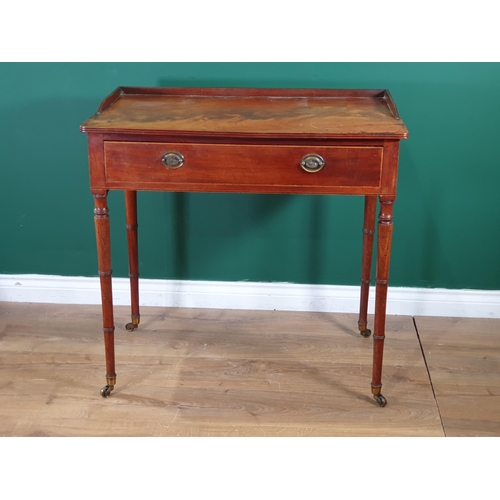 603 - A Regency mahogany Sidetable, the galleried moulded top above a frieze drawer, on slender ring turne... 