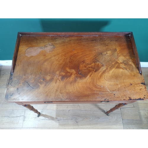 603 - A Regency mahogany Sidetable, the galleried moulded top above a frieze drawer, on slender ring turne... 