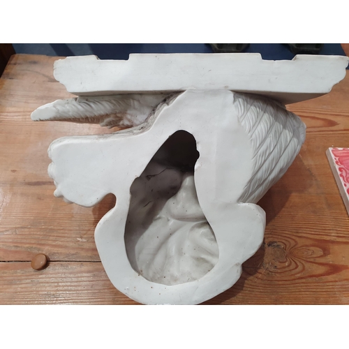 380 - A Parian ware Wall Bracket in the form of an eagle supporting a shelf, 9 1/2in