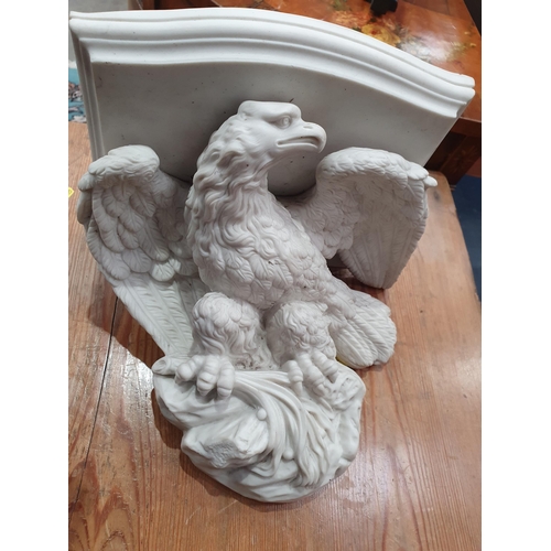 380 - A Parian ware Wall Bracket in the form of an eagle supporting a shelf, 9 1/2in