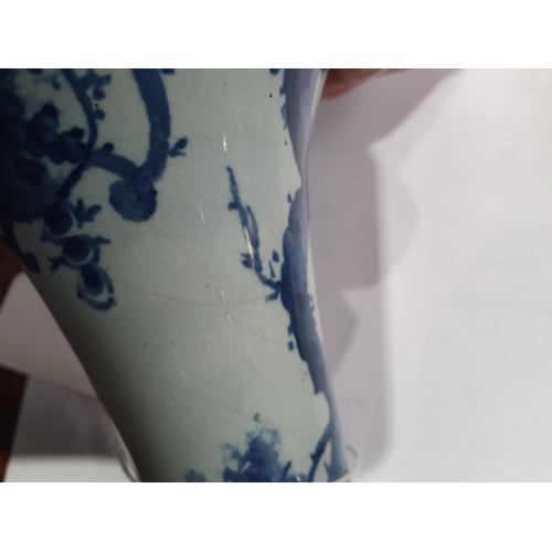 395 - An antique blue and white Delftware Vase, decorated with figures in Landscape with ornate Tree. 10.5... 