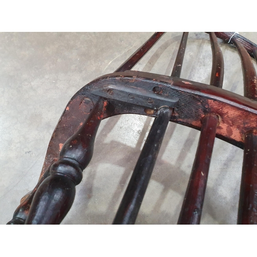 493 - A 19th Century ash stick back Elbow Chair with early black paint remnants on turned supports united ... 