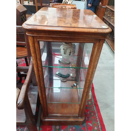 525 - A good quality late Victorian burr walnut Display Cabinet with moulded top above a single glazed doo... 