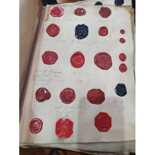 873 - A leather bound Book of historical seals, and a list of the names of the families