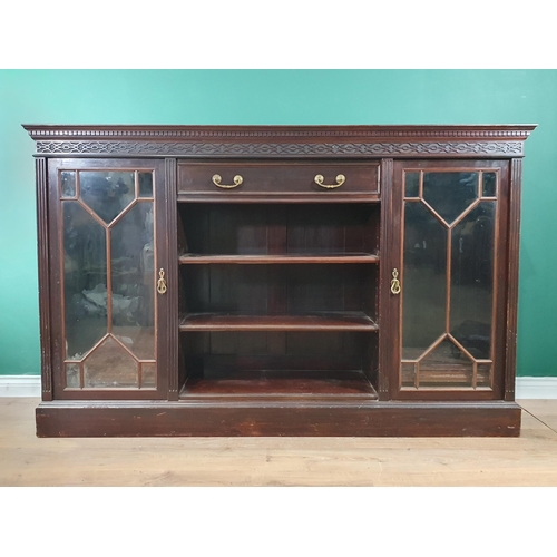 467 - A mahogany and glazed Side Cabinet by Maple & Co. with blind fret carved frieze above drawers and sh... 