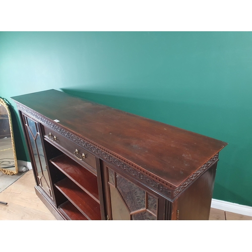 467 - A mahogany and glazed Side Cabinet by Maple & Co. with blind fret carved frieze above drawers and sh... 