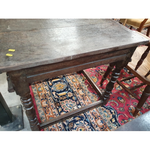 602 - A 17th Century and later oak Side Table with cleated two plank top above single drawer carved with s... 