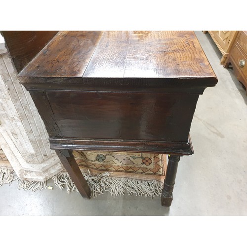 528 - An 18th Century oak Dresser Base with raised back, fitted four crossbanded frieze drawers on turned ... 