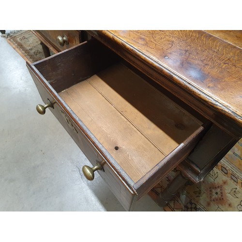 528 - An 18th Century oak Dresser Base with raised back, fitted four crossbanded frieze drawers on turned ... 