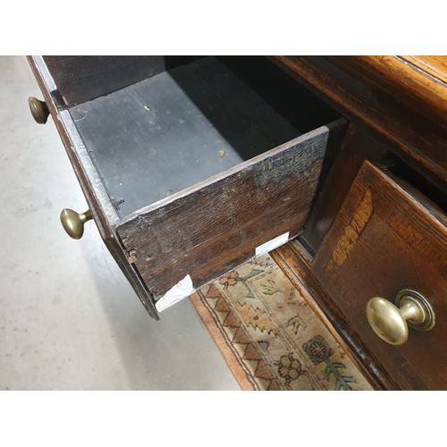 528 - An 18th Century oak Dresser Base with raised back, fitted four crossbanded frieze drawers on turned ... 