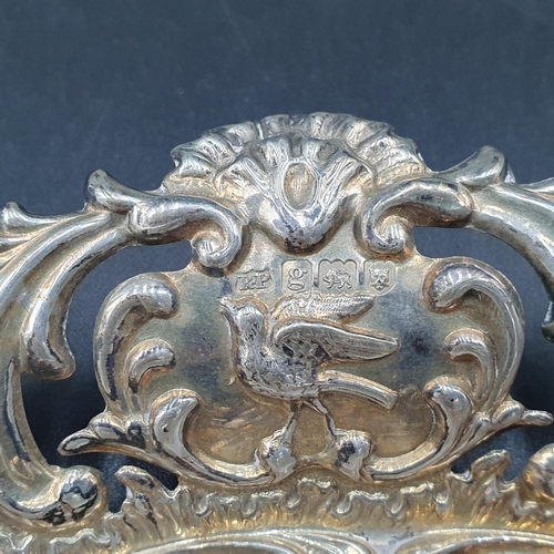 101 - An Edward VII silver pierced oval Dish with bird and scroll embossing, London 1902