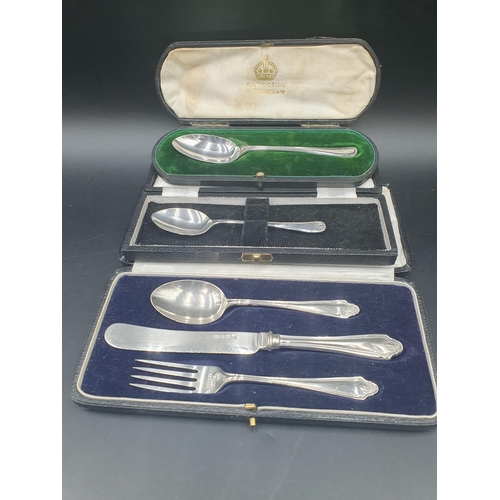 107 - A George V silver Christening Knife, Fork and Spoon, Birmingham 1926, in case, and two other boxed S... 