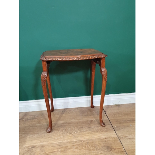 11 - A nest of three walnut veneered Occasional Tables on cabriole supports and a wing back Armchair with... 