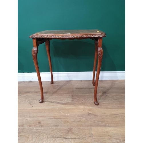 11 - A nest of three walnut veneered Occasional Tables on cabriole supports and a wing back Armchair with... 