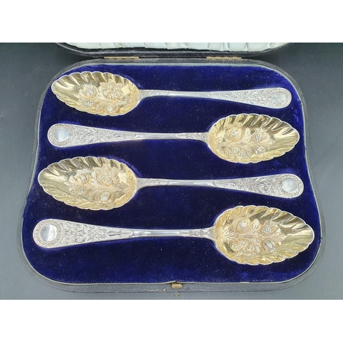 110 - Four Victorian silver Fruit Spoons with embossed gilt bowls and ornate stems, London 1893, maker: E.... 