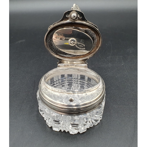 120 - A Victorian silver lidded circular cut glass Inkwell with leafage scroll engraving, London 1850, gla... 