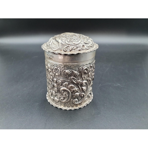 123 - An Edward VII silver cylindrical Box and Cover with bird and floral scroll embossing, London 1906