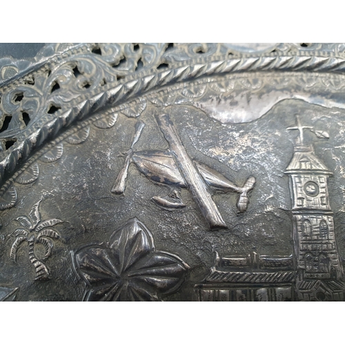 124 - An Indian silver oval Panel embossed and chased central building, birds, airship, etc, 8 x 6in