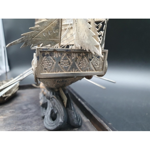 143 - A Chinese silver three masted Sailing Boat with figures and oars, and two smaller vessels, all under... 