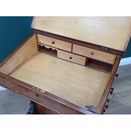 15 - A Walnut Davenport with hinged lid with inset writing surface, with four fitted side drawers, with c... 