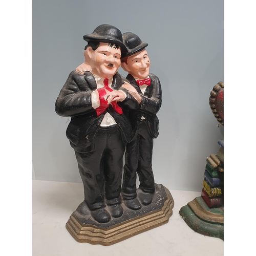 19 - Four cast metal Doorstops in the form of Punch and Judy, Laurel and Hardy and a British Bulldog (R3)