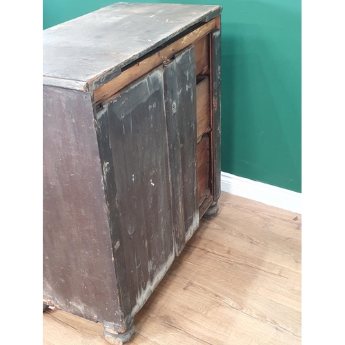 2 - A Black Painted Pine chest of two short two long drawers raised on bun feet 3ft W 3ft 2