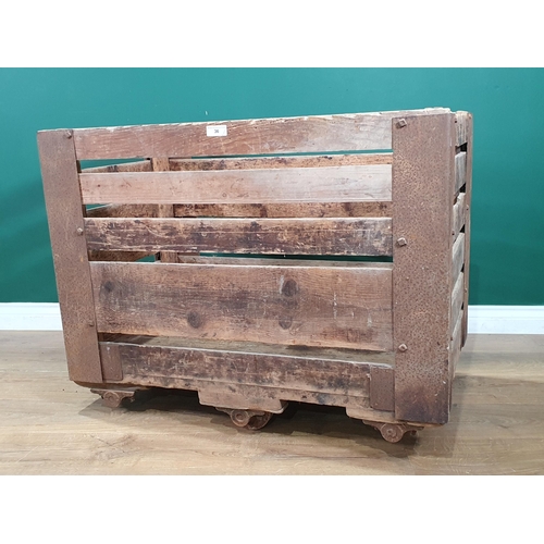 36 - A pine slatted metal bound Factory/Laundry Cart on wheels, 3ft 1