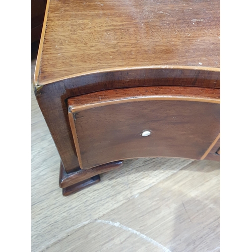 400 - A mahogany and satinwood serpentine Shield shaped Dressing Mirror with three fitted drawers raised o... 